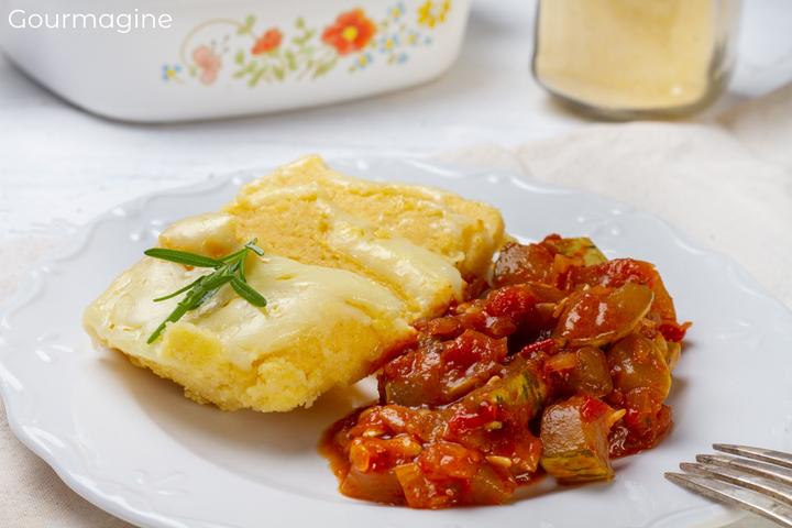 White plate with Linthmais polenta and an aubergine zucchini tomato ratatouille next to it
