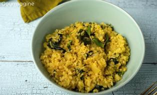 Cooked bulgur and spinach served in a grey-blue bowl